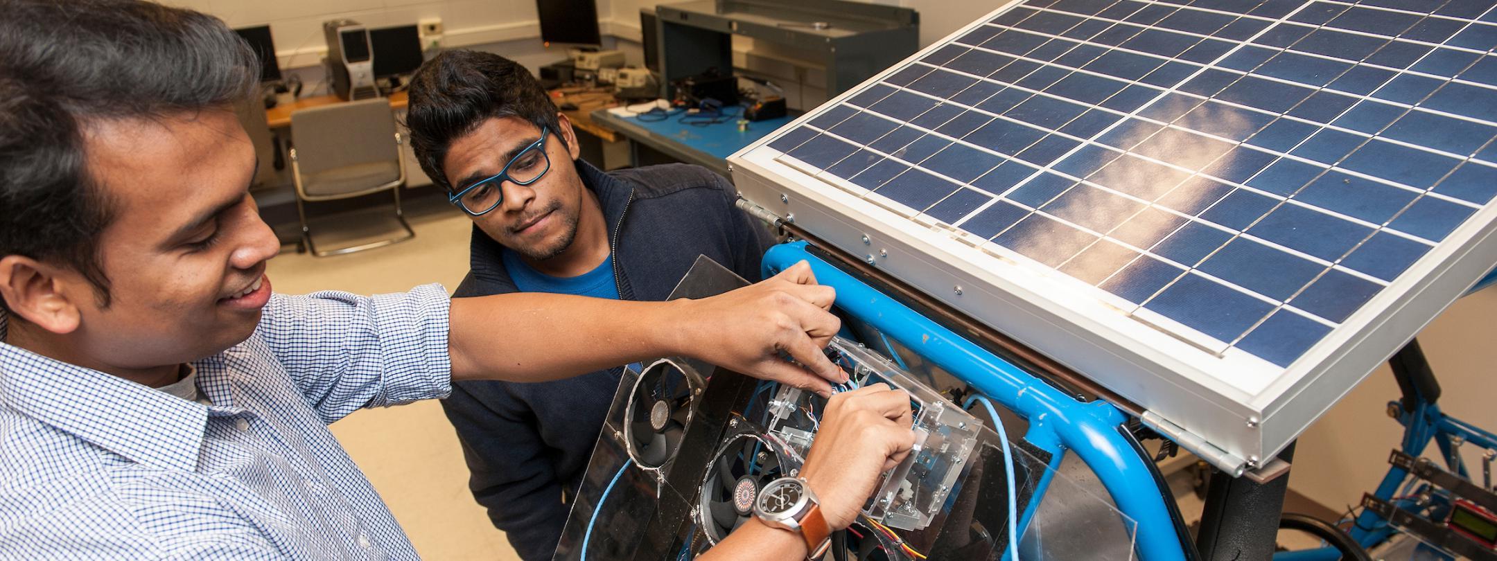 Students working on solar panel